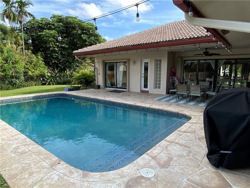 Photo of 3933 NW 72nd Dr, Coral Springs, FL 33065 (MLS # F10327380)