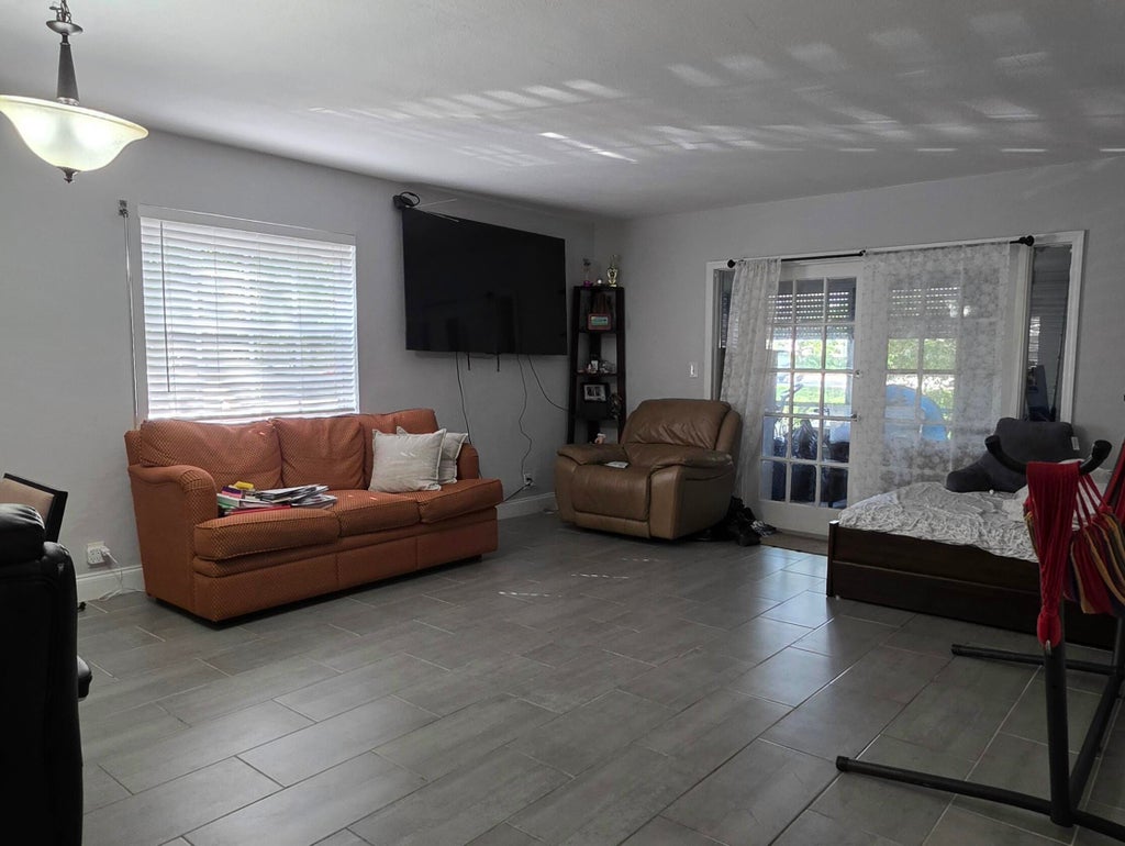 Photo of 7556 Stirling Road #117, Davie, FL 33024 (MLS # B26092500)