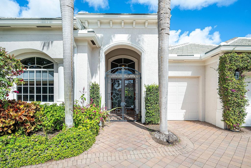 Photo of 114 Vintage Isle Ln, Palm Beach Gardens, FL 33418 (MLS # B26000822)