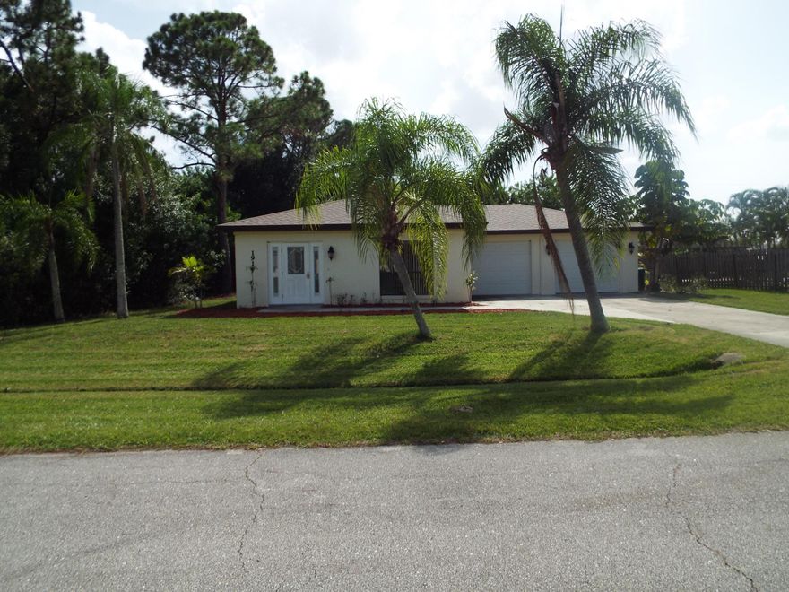 WOW !!! NICE 3 BEDROOM 2 BATH WITH 2 
LARGE SEPARATE GARAGES. TILE LIVING AREA 
AND 3 BEDROOMS HAVE WOOD VYNAL
FLOORING. GRANITE KITCHEN, MINUTES TO CROSSTOWN PKWY, i-95 SAINT LUCIE WEST SHOPPING, AND  AMENITIES, AND THE TURNPIKE.