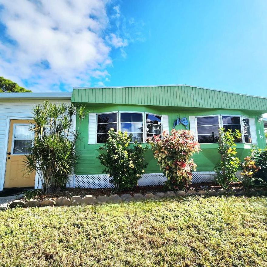 Furnished 2 bed/2 bath w/ a beautifully renovated, large, well lit, fully enclosed Florida Room that serves as an extra room/den/office & more! Great Lot w/ tropical vibe, canal views w/ small yard space for Gardening & Pets. Master bedroom features an en-suite bathroom & both bedrooms offer generous closet space. Large Shed for ample Storage! 2019 AC has been fully serviced in 2025. PRIME LOCATION; close to the beach, the mall, grocery stores, diners, coffee shops, post office, banks, pharmacy, hospitals & more. Lot lease of 842.53 includes lawn care, trash, private, free golf course, heated pool, pickleball, tennis, shuffleboard, bocce, gym, library, cards, Mahjong, bible study, wood workshop, dinners, parades, dances & more!