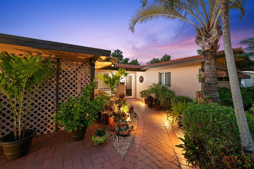 Tucked away on a quiet, non-cut-through street in the heart of Lighthouse Point, this charming home offers the perfect blend of comfort and coastal living. Enjoy your morning coffee on the covered patio, surrounded by lush tropical landscaping that makes every day feel like a getaway. The open, airy layout invites natural light to pour in, creating a warm, welcoming space that’s perfect for both quiet mornings and lively evenings with friends. Featuring a 2021 roof, impact windows/doors (with the exception of the front door), and a new electric panel with underground FPL service, this beautiful home is just minutes from beaches, dining, and shopping. Don’t miss this peaceful retreat—schedule your private showing today! Sqft from owners.
