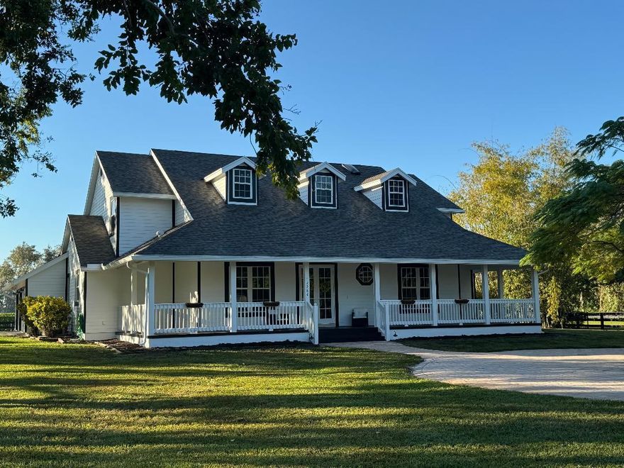 Welcome home to a one-of-a-kind equestrian retreat where modern comfort meets country living. This beautiful 6-bedroom, 4-bathroom farmhouse sits on 5.25 peaceful acres and offers everything you need for a relaxed, spacious lifestyle-- with room for both your family and your horses. The 8-stall concrete barn has a groomer's quarters, and the private 200 x 100 riding arena makes it easy and accessible. The land is flat & open, with plenty of space for turnout and grazing--all fully fenced for peace of mind. Whether you're looking for a peaceful countryside setting, a place to grow with your animals, or simply a breath of fresh air, this property offers it all!