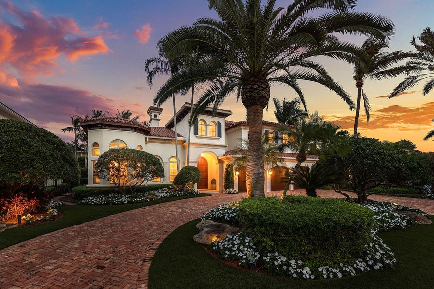 2386 W Maya Palm Drive is an elegant traditional estate on a quiet interior street in Royal Palm Yacht & Country Club, offering timeless architecture and a warm, inviting atmosphere. This 5-bedroom home features approximately 5,000 SF of refined living space, with marble flooring on the main level and bright east exposure that fills the interiors with natural light. The first floor includes a luxurious primary suite with his and her baths, a private office, and generous formal and casual living areas that function well for both everyday living and entertaining. French doors open to the pool and patio, promoting an easy indoor-outdoor flow and views of the landscaped grounds.   Outside, the backyard provides ample space for lounging, dining, and poolside enjoyment, framed by mature tropical landscaping for privacy. The home combines classic Royal Palm style with comfortable South Florida living.