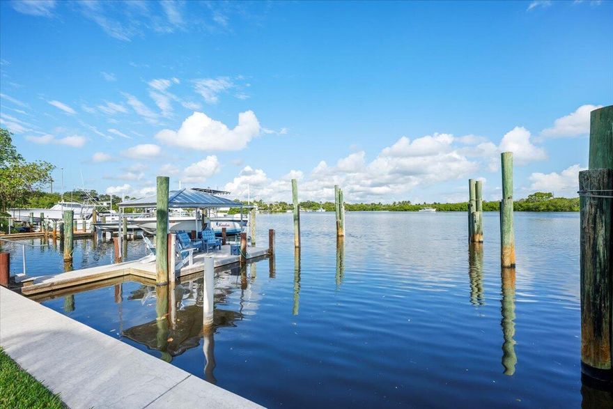 Premier Waterfront Opportunity in Yacht Club Estates! A boater's dream location. This .30-acre waterfront property offers 75 ft of deep-water frontage with no fixed bridges, just seconds to the Intracoastal and minutes to the Jupiter Inlet. Positioned directly across from scenic Sawfish Bay, enjoy wide-water views and quick access to Jupiter's best waterways, beaches, and dining. The property features a new seawall, 16,000 lb lift, dock and pilings that can accomodate a 54 ft boat. Whether you choose to enjoy the existing 3-bed, 2-bath renovated home or build your custom waterfront estate, this rare offering in Yacht Club Estates provides unmatched flexibility and lifestyle potential with no HOA. Bring your vision and make the most of this prime Jupiter waterfront location!