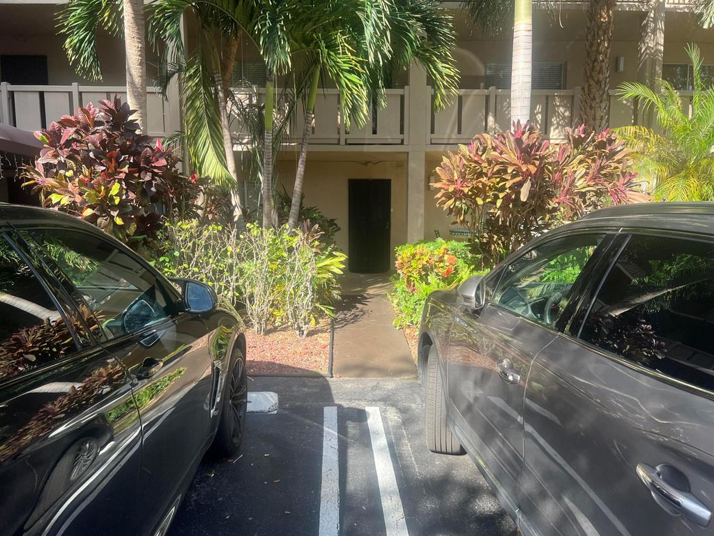 Photo of 2208 S Cypress Bend Drive #106, Pompano Beach, FL 33069 (MLS # R11147350)