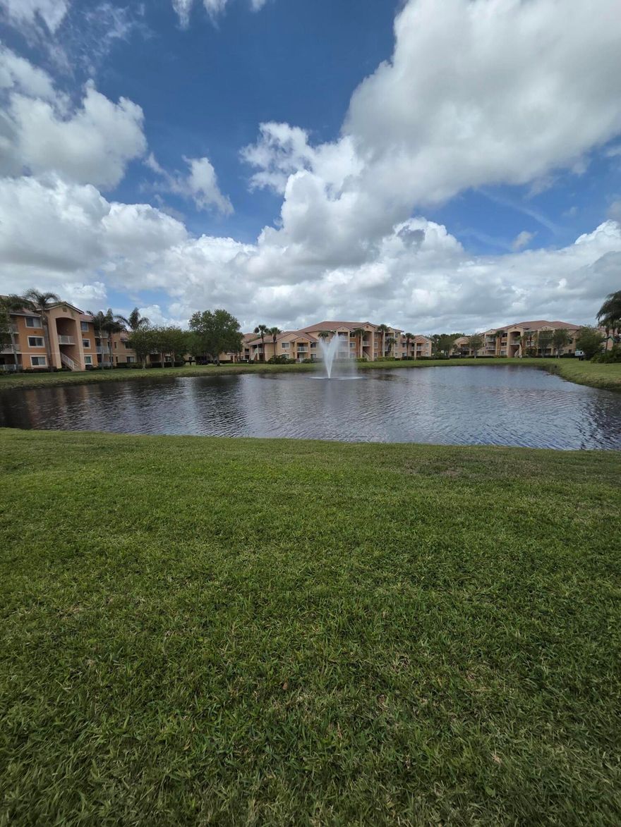 Ground floor 2/2 corner unit with lots of natural light and water view from every room!.  The large covered balcony overlooks the wide pond with its waterfountain. The kitchen has upgraded cabinets and granite countertops.  Laminate flooring throughout.  Tenant-occupied until end of May.  Tenants are not renewing their lease.   The Club is a gated community near I-95 with a clubhouse, a pool, a fitness center, a tennis/pickleball court, playground, and a BBQ area.  The unit is priced aggressively for a quick sale.  Seller paid in full the roof  special assessment!  Great value for buyer!  Community has a new roof and currently all buildings are being repainted enhancing property appearance and value.  The Club is financially sound and is professionally managed.  Manager on site.