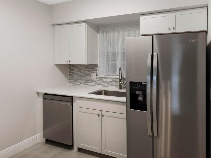 Beautifully updates first floor unit, must be seen to be appreciated.  Gorgeous kitchen with quartz countertops, kitchen with all brand new major appliances.  Updated bathrooms, luxury vinyl flooring and high based boards throughout.  Screened in patio, rolled down and by-fold hurricane shutters throughout.  Two community heated pools, clubhouse with fitness gym, card room, huge auditorium with kitchen.  Minutes from two major shopping centers (Publix, Winn-Dixie, Pharmacy and restaurants).  Easy to show, quick possession.