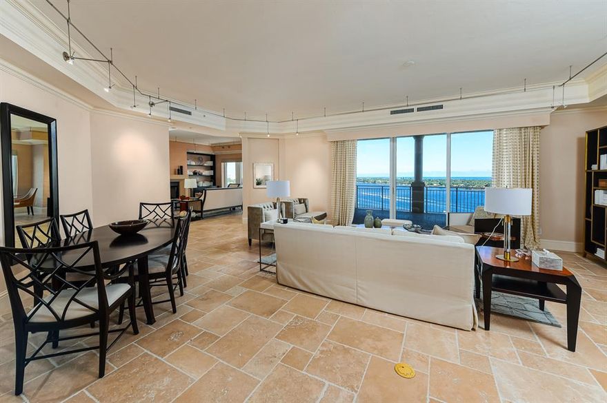 Simply stunning, modern, four bedroom on prized high floor location with stellar panoramic water views.  Its exciting and well-scaled customized space are ideal for the art collector.  With richly appointed interior details and a flexible floor plan, this is a creation for the discerning who want to move right in!  Gracious oversize master suite, elevator directly to your apartment in this desirable full-service white glove building with dog run, full-time security and concierge, two car spaces, storage bin, new entrance, lobby, pool on the Intracoastal, great gym, movie theater, boardroom, guest suites and more.