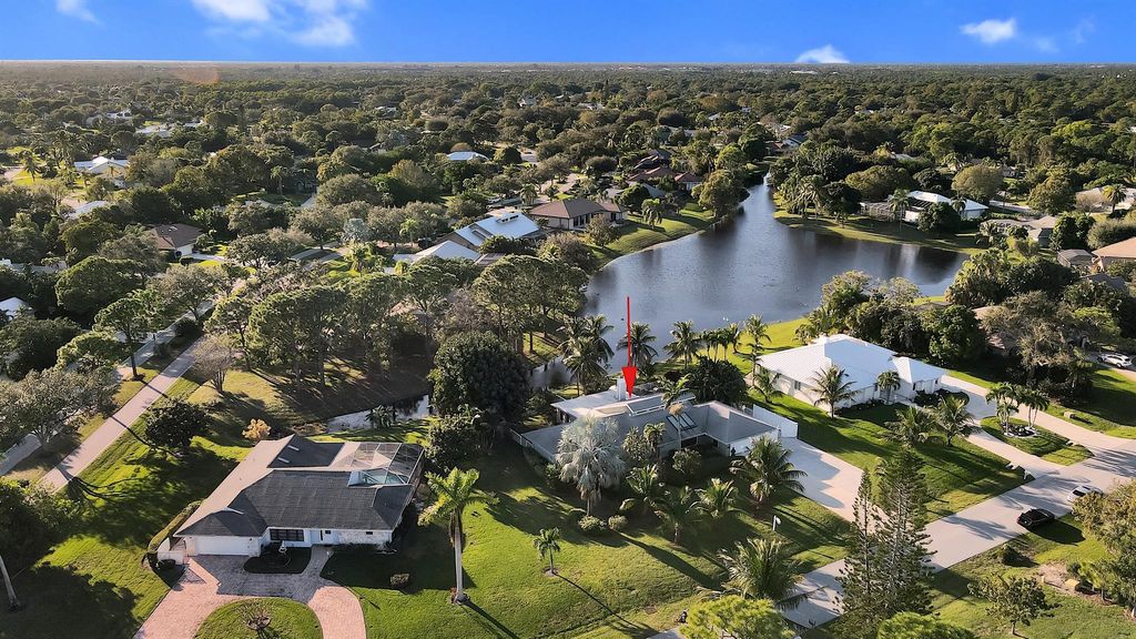 Photo of 3114 NE Loquat Lane, Jensen Beach, FL 34957 (MLS # R10935151)