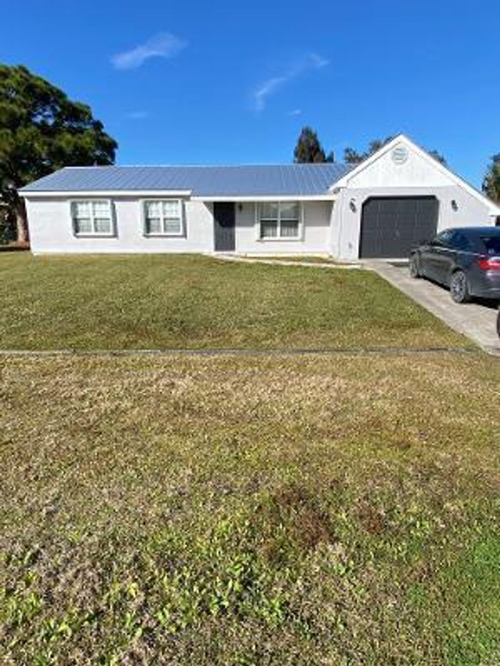 Photo of 1185 SE Maxwell Lane Ln, Port St Lucie, FL 34952 (MLS # R10776935)