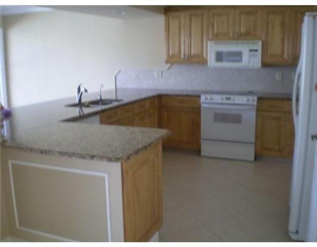 Photo of 1055 SW Benchor Avenue, Port Saint Lucie, FL 34953 (MLS # R11077213)