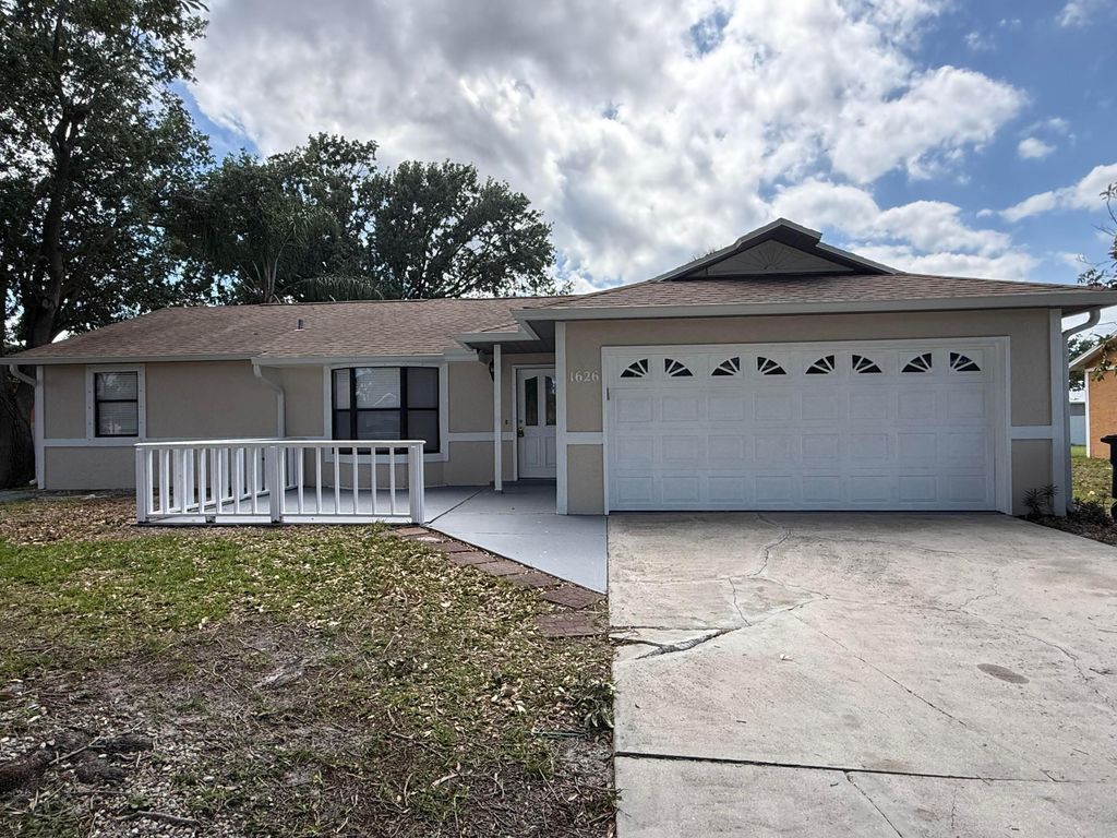 Photo of 1626 SW Buffum Lane, Port Saint Lucie, FL 34984 (MLS # B26020335)