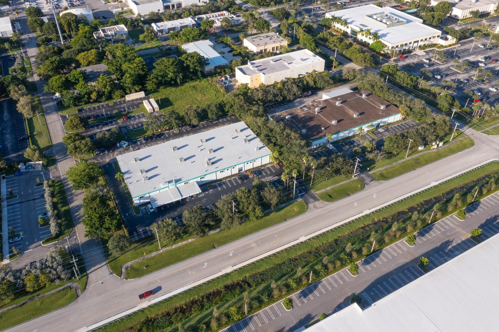 Expansive industrial office warehouse property made up of 2 buildings on 5.4 acres. West Bldg is 34,396 square feet East Bldg is 28,000 square feet. Both buildings have new roofs. West Bldg has Full bldg generator, covered car port parking, 4 electric street level bay doors, staircase entrance w/ elevator, admin/exec offices, dedicated server room w/ AC units for temp control, mezzanine area for storage or addt'l work space, large open work area. East Bldg has 5 electric street level bay doors (2 w/ industrial cover), & 1 loading dock bay door for a total of 6 bay doors. Shared features: Fully fire sprinklered, fire panel w/ duct detectors, LED Hi-Bay Lighting, ceiling exhaust system, wired w/ Cat 6, 3 phase power, 18 foot ceilings, 100% A/C.