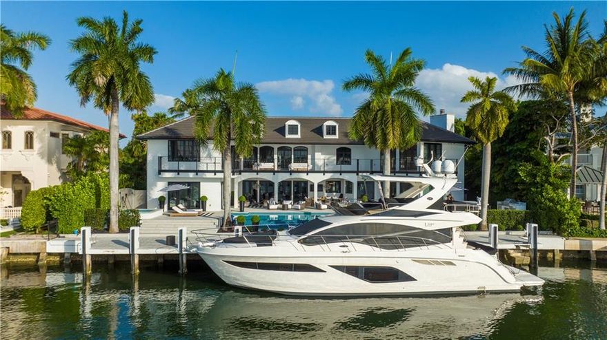 PREMIER LOCATION & KNOCK-OUT VIEW! 109' of unbounded opulence paired with incredible views of Lake Sylvan in Harbor Beach define this breath-taking recently renovated estate with voluminous 8,000 sq ft of AC living areas. Appointed with designer detailing, the formal rooms amaze. 2 main bedrooms, one on each floor, offer sunset views of the infinity-edge pool and the lake. Main upstairs ensuite bedroom includes an extra-large walk-in closet, luxe exercise room, and a spa-inspired lake-view bathroom. Huge gourmet center-island kitchen is fitted with a Wolf 60" gas range, Subzero's wine coolers, and ample built-ins. Additional amenities include a gym/captain’s quarters w/kitchenette, office, 2 laundry rooms, 3-car garage, outdoor kitchen, and dockage for up to an 89' power or sailing yacht.