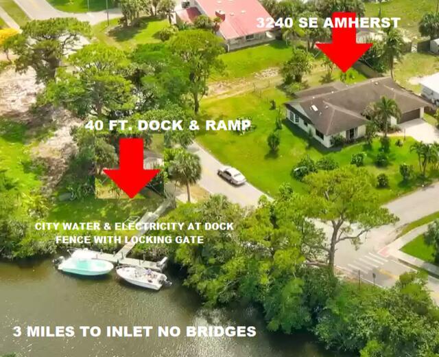 A boaters dream! Custom built home located on a double corner lot just minutes from Stuart's Banyan Trees & Sandsprit Park. Also includes a 40 ft boat dock directly across the street. The dock includes electricity, city water, no bridges and just 3 miles to the inlet! Custom 225 gallon salt water fish tank included as well! This is a beauty!