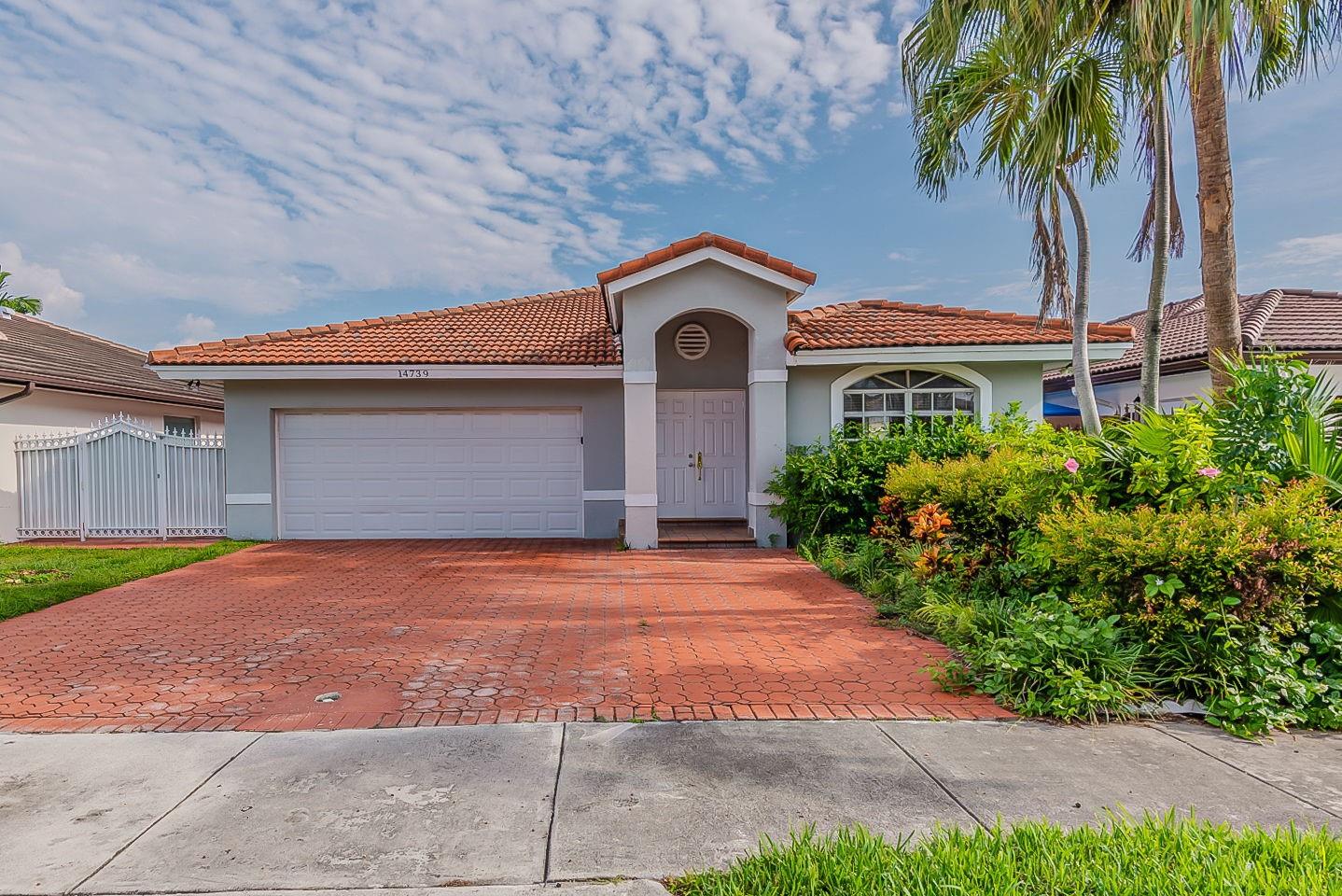 This inviting one-story home features 4 bedrooms, 2 bathrooms, and a 2-car garage. Inside, you’ll find an open design with a kitchen bar perfect for casual dining and entertaining. The primary suite includes a spacious closet, double vanity, separate tub, and shower for added comfort. Step outside to enjoy a covered porch overlooking the fenced backyard, ideal for relaxing or gatherings. Schedule a showing today! One or more photos have been virtually staged.