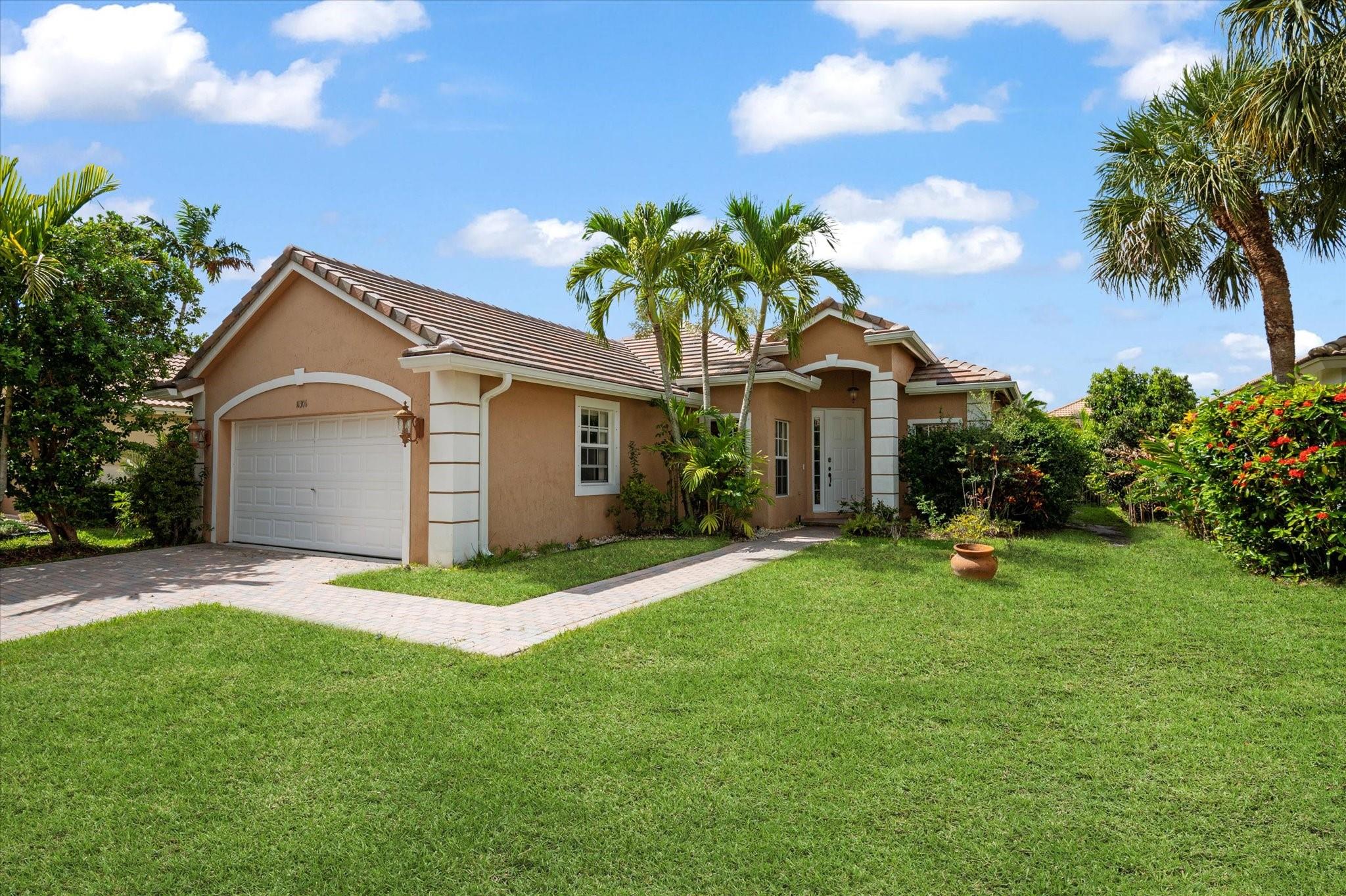 4-bedroom, 2-bath Tavernier model in the sought-after guard-gated community of Parkland Isles! Featuring a new roof (Nov. 2024) and 2018 A/C with coil replaced in 2025. The kitchen boasts 42” wood cabinets, granite countertops, and newer stainless steel appliances. Additional highlights include a 2021 water heater and hurricane protection throughout. Enjoy resort-style living with access to a stunning clubhouse, state-of-the-art gym, tennis and pickleball courts, teen room, heated pool and spa, basketball courts, and more. This is the Parkland lifestyle you've been waiting for!