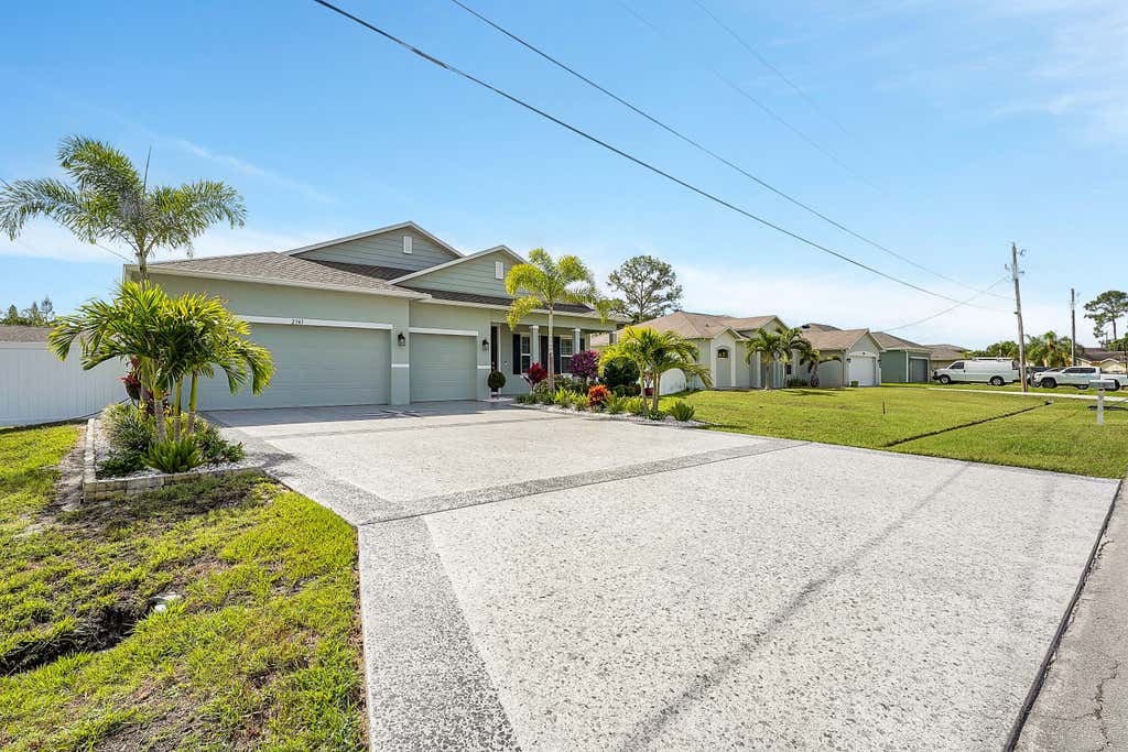 Photo of 2343 SW Madrid Road, Port Saint Lucie, FL 34953 (MLS # R10989891)