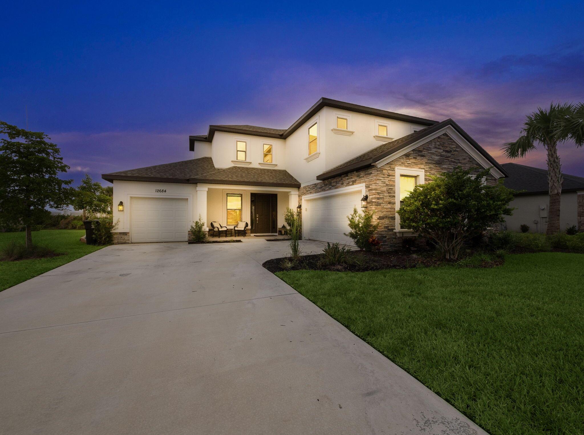 Welcome to luxury living at its finest in the highly sought-after community in Tradition! This extraordinary 5-bedroom, 4.5-bathroom estate home is a masterpiece of design and craftsmanship, boasting an array of premium upgrades and thoughtful features that create an unparalleled living experience. Upon entering, you are greeted by an expansive open-concept floor plan that immediately conveys both grandeur and warmth. High ceilings and large windows allow for abundant natural light, enhancing the home's sense of space and airiness. The thoughtfully designed layout is perfect for both intimate family living and grand-scale entertaining. The home is pool and outdoor kitchen ready with plumbing, electric, and gas already installed.