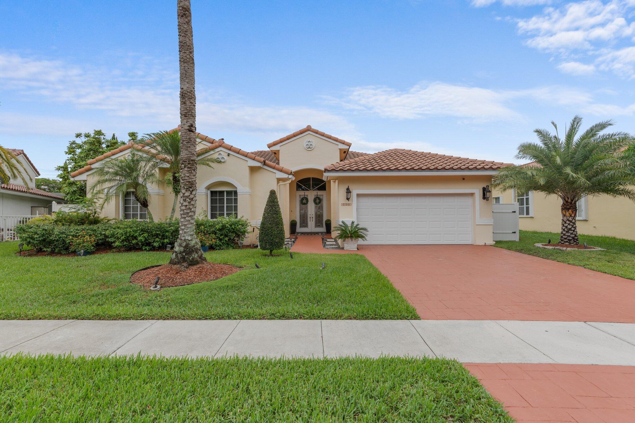 Showings have started. Owner occupied. Showing schedule is as follows:Monday -Friday 5-7pm. Sat- Sun 12pm-6pm. Top of the line rarely available listing in the area. Gorgeous 4/3 lakefront pool home with the best water view. Everything is impeccable and top of the line. You will find Granite, wood, and stainless custom kitchen; real wood floors and beautiful porcelain tile. Abundant natural light. Crown molding and vaulted ceilings. Large patio surrounding heated pool and spa, fenced yard with mango and avocado trees. New pergola. Perfect for entertaining. Roof is 10 years old