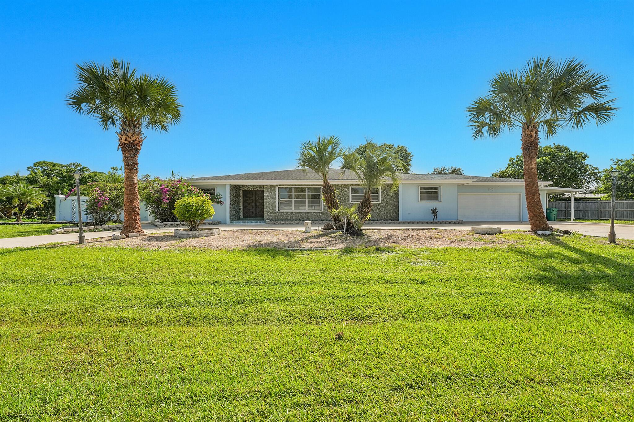 Welcome to 154 NE Naranja Ave! This spacious 4-bedroom, 3-bath, 2-car garage pool home sits proudly on a corner lot with 3,700 sq ft under air. The home is in great shape and move-in ready, offering a bright open layout, generous room sizes, and a backyard built for relaxing or entertaining. Don't miss your chance to own this slice of Florida living! Call today for a private tour!!