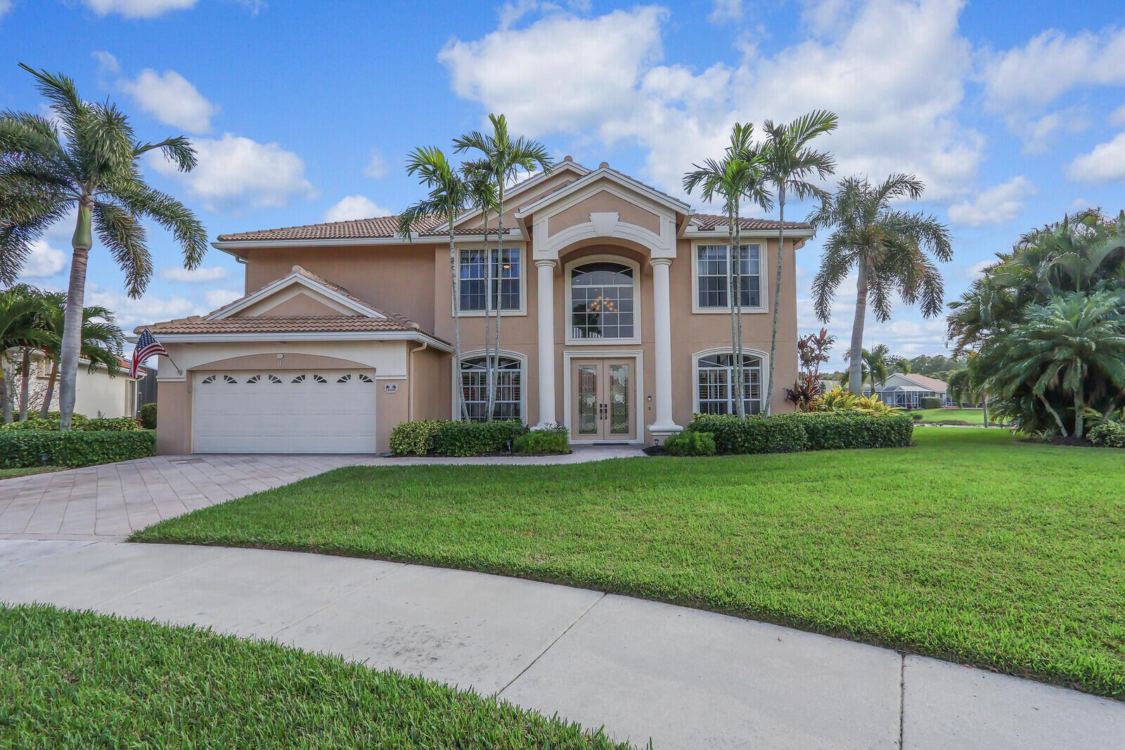 NEW ROOF INSTALLED MARCH 2019Welcome to this exquisite 5-bedroom, 3.5-bath home, perfectly situated in the coveted gated community of Lake Charles. Located on a quiet cul-de-sac, this stunning property offers a breathtaking lake view and sits on an over-sized third-of-an-acre lot surrounded by lush palm trees, creating a tropical paradise ambiance. With easy access to shopping, dining, Mets Spring Training, and I-95, this home combines convenience with serene luxury. Upon entering, you'll be captivated by the grand wrought iron spiral staircase, featuring two-way access, which leads to the second floor. Upstairs, the spacious primary en-suite bedroom boasts a spa-like bathroom quartz vanities, complete with a walk-in shower, a separate soaking tub, and abundant closet and storage space.