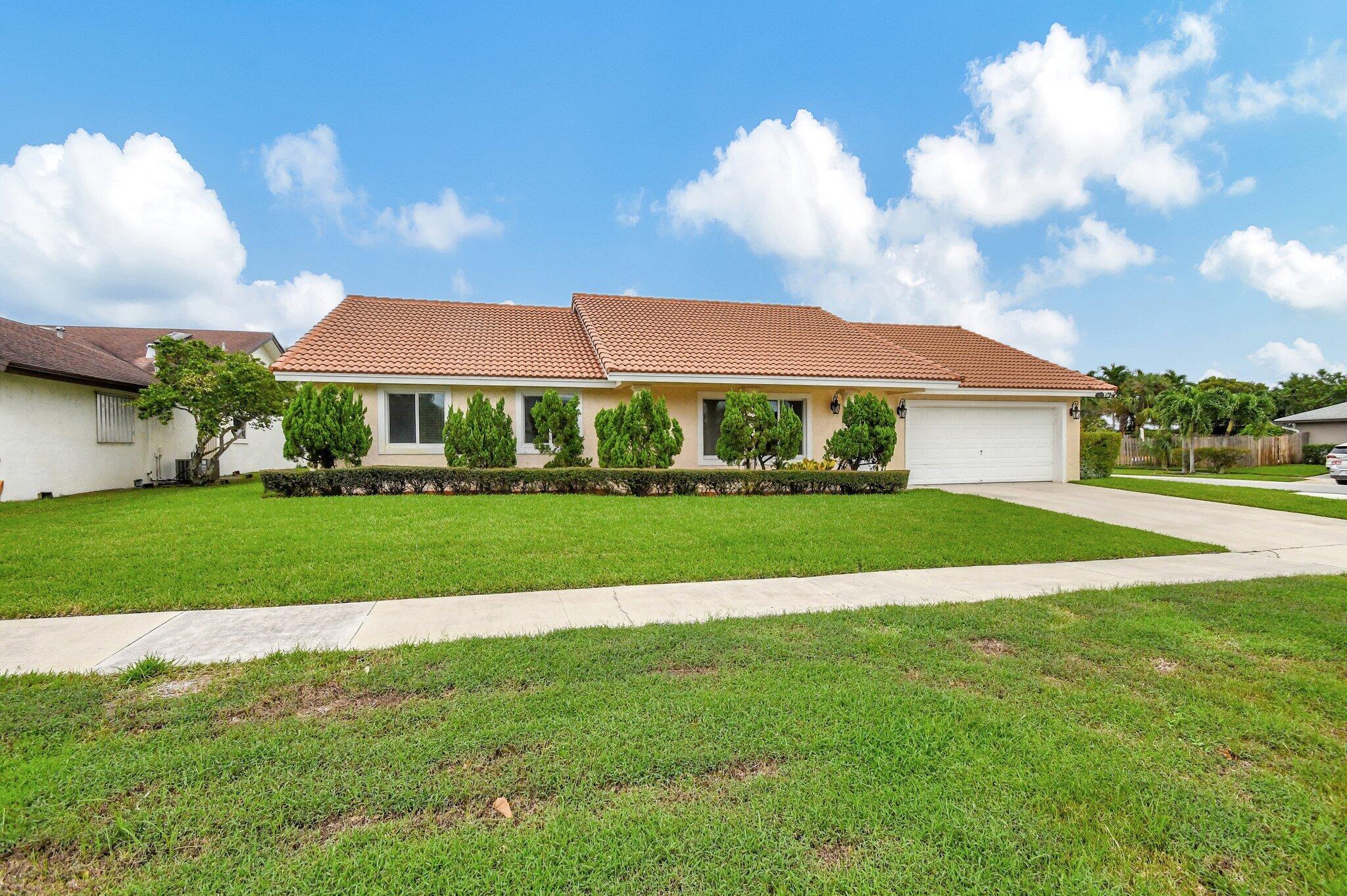 Welcome Home to This Beautiful Updated 3 Bedroom, 2 Bath Residence with a 2 Car Garage in the Desirable Community of Pheasant Walk. Designed for Comfort and Style, this Home Offers Everything you need for Modern South Florida Living. Spacious Floorplan with Vaulted Ceilings and Abundant Natural Light. Enjoy Elegant Tiles Floors Through-Out with an Updated Kitchen, Granite Counter-tops and Modern Cabinetry. French Doors Lead Out to a Large Covered Patio and White Fenced Backyard. Perfect for Entertaining and Ideal for Pets, Yes, Pet Friendly. Impact Windows and Doors Provide Peace of Mind and Efficiency. Community Playground for Children, Plus Top Rated Schools. Just Minutes from Boca Raton Beaches, Mizner Park, Atlantic Ave, Shopping and Fine Dining.