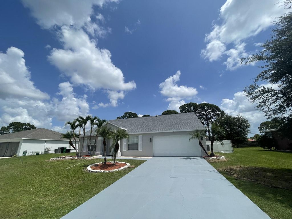 Photo of 1137 SW Coleman Avenue, Port Saint Lucie, FL 34953 (MLS # R11164050)