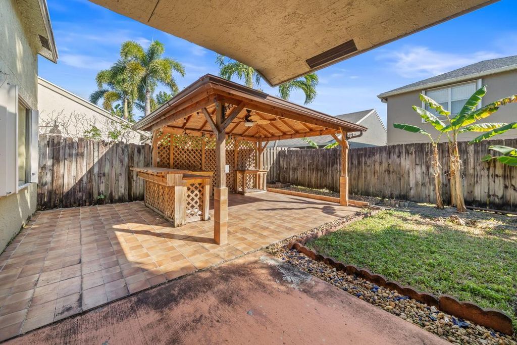 Photo of 113 Cypress Lane, Royal Palm Beach, FL 33411 (MLS # R11155779)