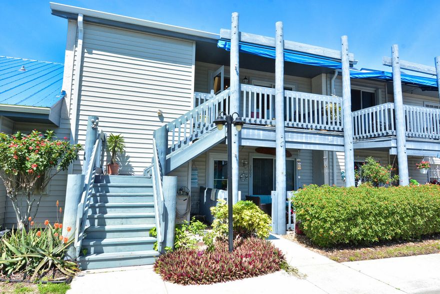 DON'T WALK RUN!CORNER UNIT UPDATED AND FURNISHED! 2Bed/2Baths Split Plan with High Ceilings! White Kitchen update in 2019 with Granite and Stainless Appliances, Updated master Bath 2019 ,AC and HWH, Impact Glass Sliding Doors and Windows in 2020! Stove, Refrigerator 2023 and Washer 2026!2nd Bedroom Has Murphy Bed and Computer Desk Area! front and Back Porches! Covered Parking! All ages, 2 pets allowed, trucks allowed! Community offers 2 Pools, Tennis, Pickle Ball, Shuffleboard, Community Room with Kitchen and Billiard Tables, Meeting Room, Gazebo, Boating and RV Storage Available! EZ To SHOW &SELL!