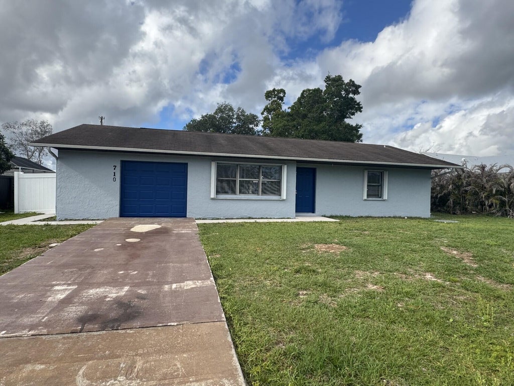 Photo of 710 NW Airoso Boulevard, Port Saint Lucie, FL 34983 (MLS # B26005965)