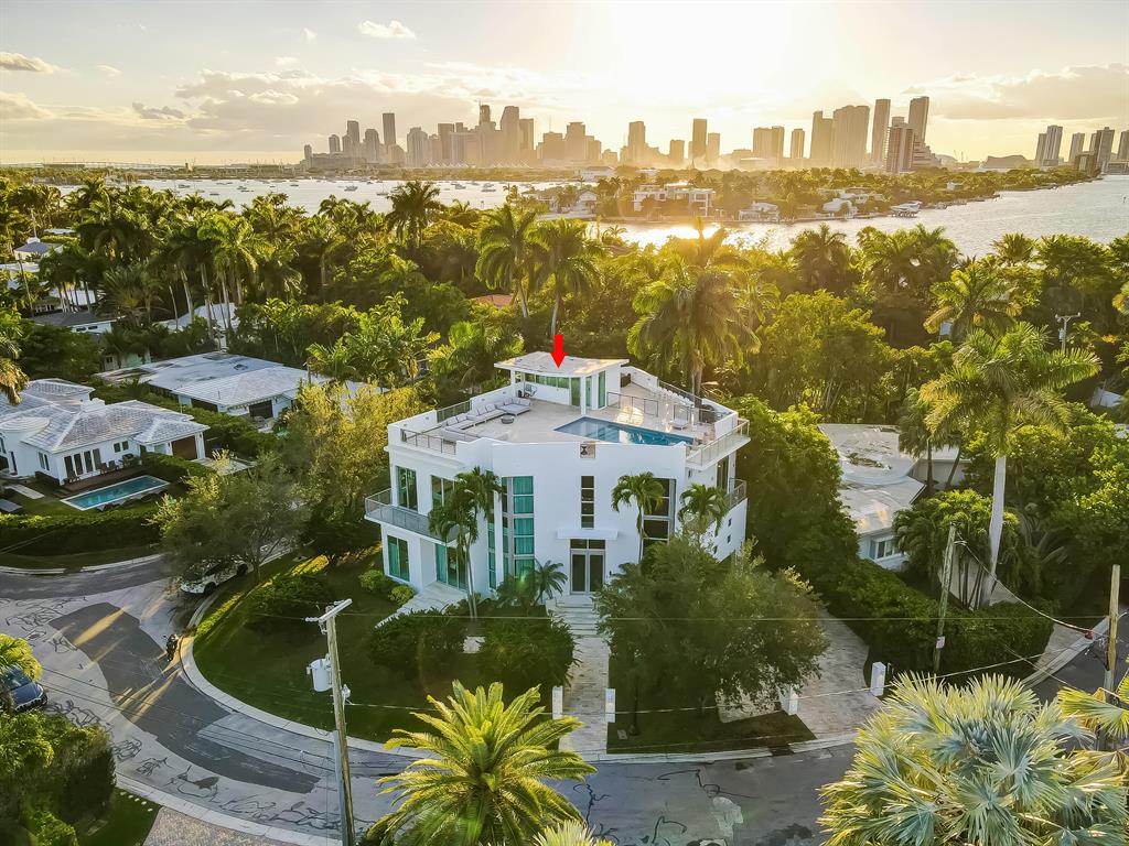Contemporary luxury at it's finest! This unique home boasts 360 degree panoramic views of Biscayne Bay from the enormous 1900 square foot roof top terrace and negative edge pool. Sitting at the northern point of the island on a 7406 sq ft lot provides you with the privacy you desire. 10 Plus Foot ceilings throughout with a double height entryway and elevator, the home greets you like a luxury hotel. Brand new furniture, design, and window treatments by Colvin Design. Brand new Savant smart home system controls security cameras, alarm system, lighting, music, thermostats, and entry. 3 Brand New A/C Units, brand new tankless gas hot water system, brand new natural gas cooktop. Freshly painted inside and out. Floors have been refinished and sealed. Furniture/Decor are negotiable.