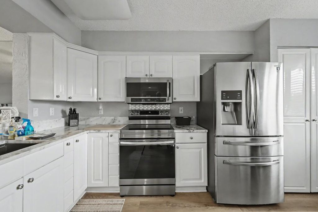 Photo of 6093 Pointe Regal Circle #303, Delray Beach, FL 33484 (MLS # R11155434)