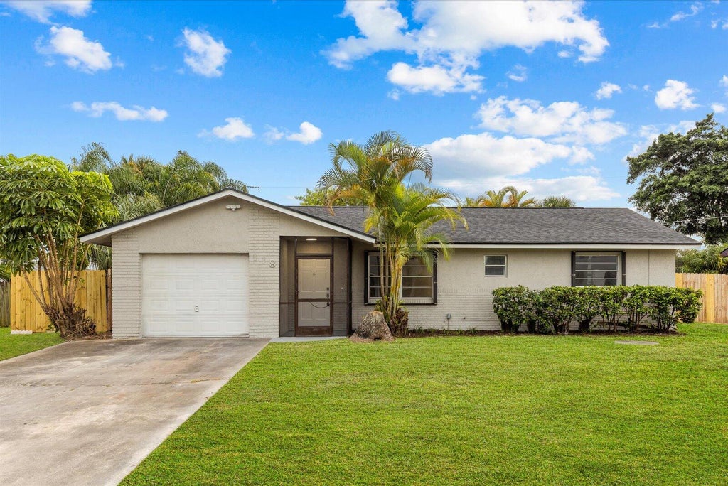 Photo of 118 SW Lancaster Avenue, Port Saint Lucie, FL 34984 (MLS # R11138901)