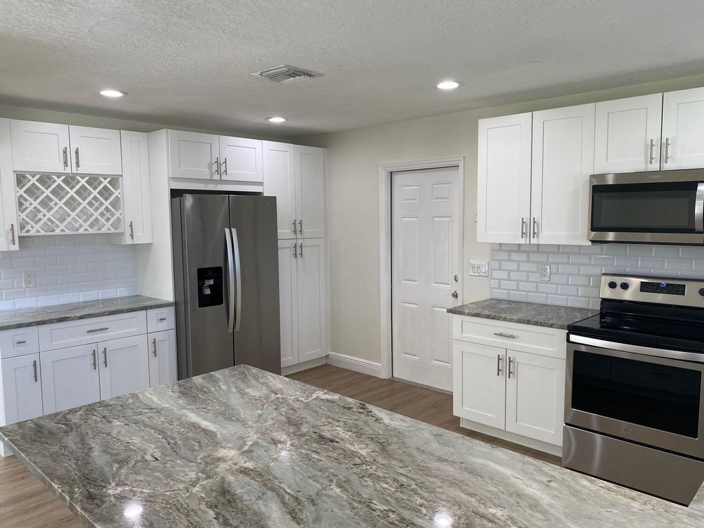 Photo of 2751 NE 26th Terrace, Boca Raton, FL 33431 (MLS # B26008837)