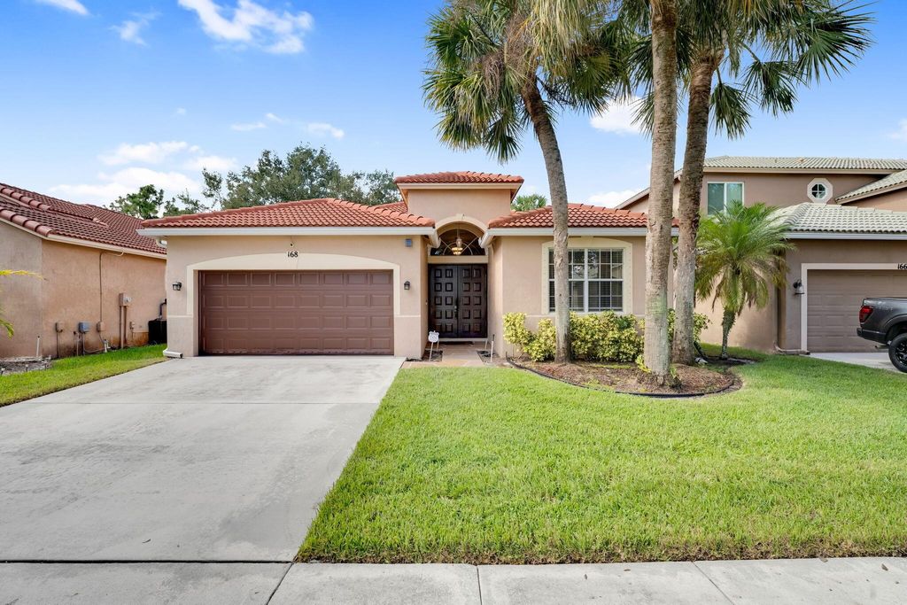 Photo of 168 Seminole Lakes Drive, Royal Palm Beach, FL 33411 (MLS # R11148532)