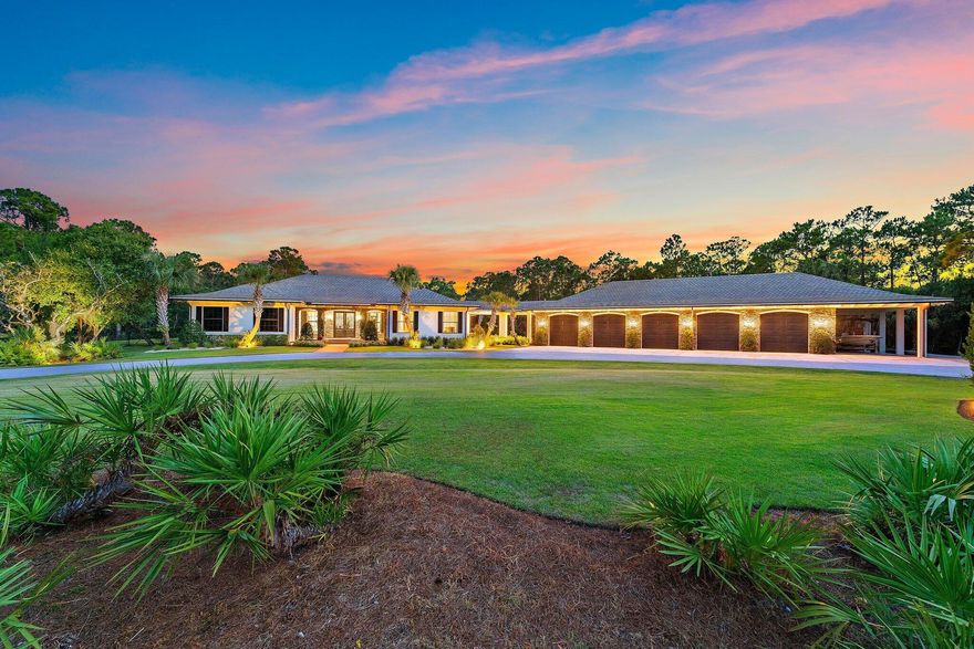You may have heard it before, but THIS home is truly one of one. Situated in the heart of Jupiter in a private, gated sanctuary on over 5 acres is a 4-bedroom, 4.5-bathroom residence with office/flex room, theatre, game room and wine room. It was built in 2016 by renowned local luxury builder D&D Specialties. Touting 5,500 square feet of living space AND a 3,000 square foot, air-conditioned 10+ car garage complete with its own office and gym. Entertain guests or keep your skills sharp on your personal par three golf hole. Take a dip in the stunning pool with champagne hot tub and beautiful Ipe wood deck. Natural and manicured landscaping provides a dramatic approach and solitude from the outside world. Luxury, beauty and privacy, only minutes from everything the area has to offer.