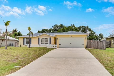 Photo of 729 SW Saragossa Avenue, Port Saint Lucie, FL 34953 (MLS # B26037237)