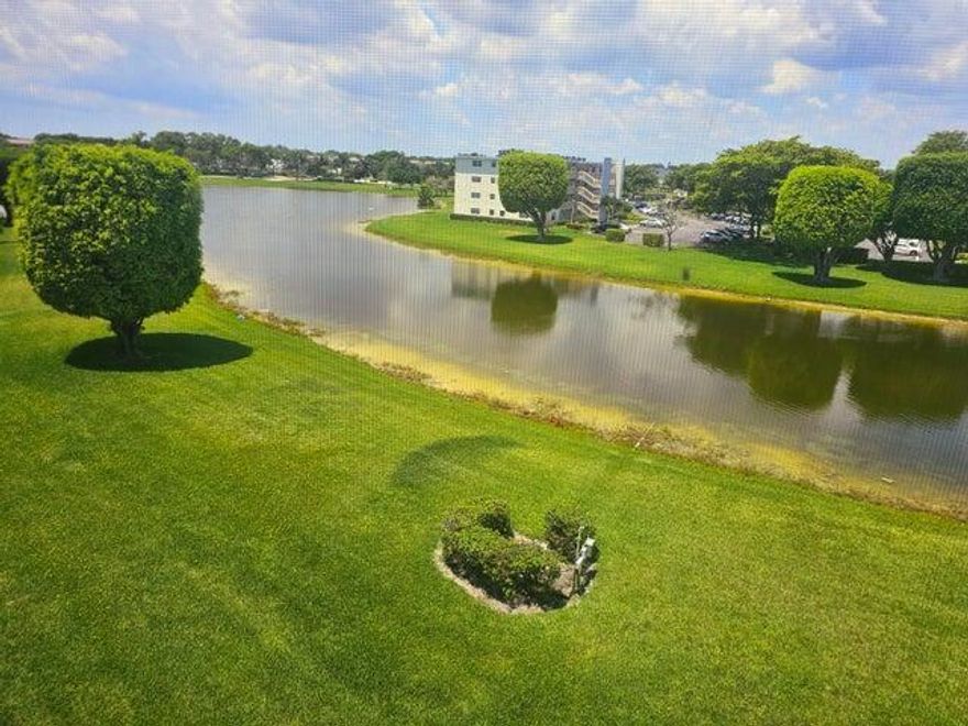 Lake view 1 bedroom ,1.5 bathroom unit across from the community pool. New range and microwave and newer appliances. Impact window on patio. Tile flooring in living area and new carpet in bedroom. 24 hour manned gate security. Easy walk to clubhouse. Tennis, Pickleball, Fitness, theater, Card Rooms, billiards, cafe, library, and much much more. Transportation buses to the community and surrounding shopping.