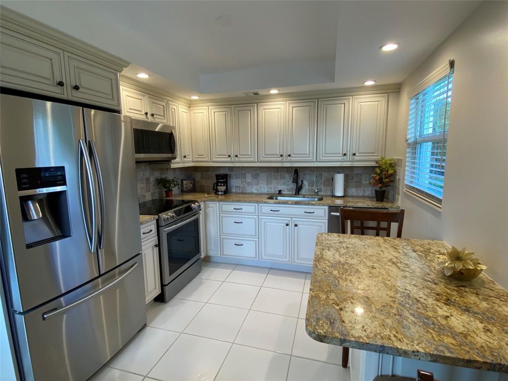 Photo of 1060 Oakridge F #1060, Deerfield Beach, FL 33442 (MLS # F10529247)