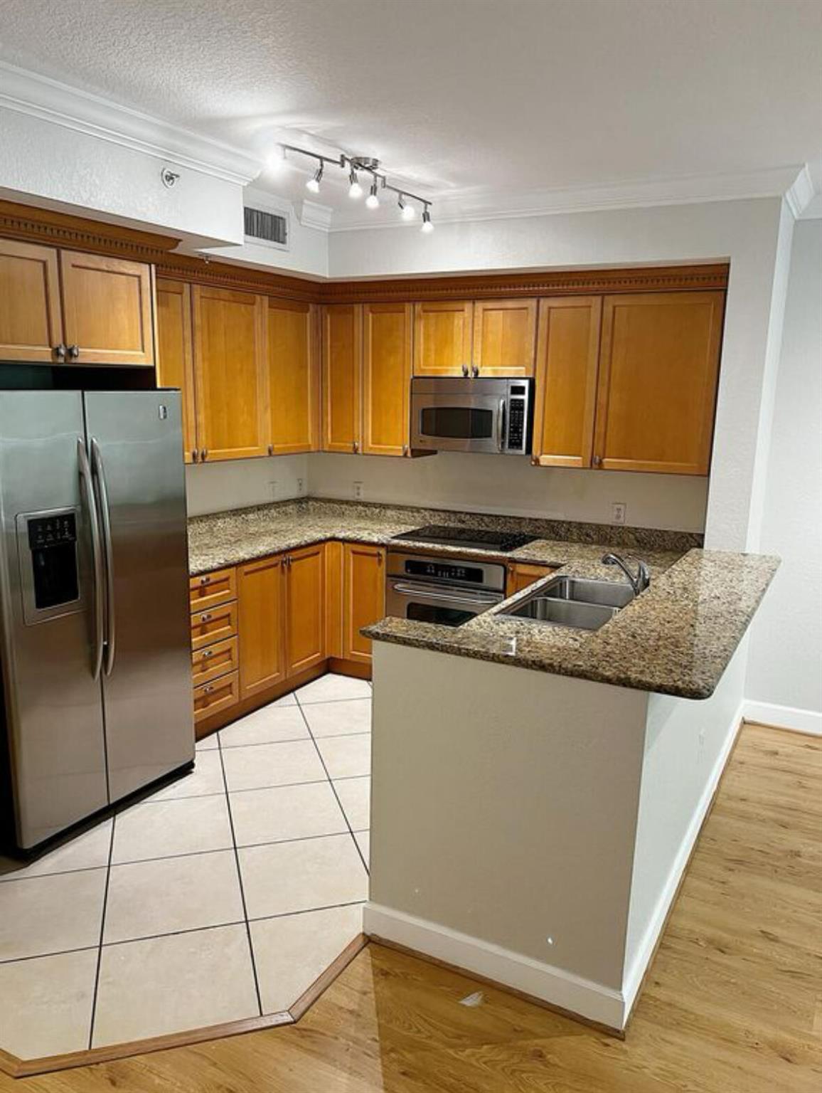 Welcome to this beautifully maintained 1-bedroom, 1-bathroom condo that combines comfort and convenience. Bright and open living space featuring sleek laminate flooring throughout. The kitchen boasts stainless steel appliances and granite countertops, perfect for preparing meals or entertaining guests. Enjoy the convenience of having your own laundry inside your home! Enjoy your own spacious private patio, ideal for relaxing or enjoying a morning coffee. The building offers great amenities including a fitness center and a community pool. Located just minutes from major highways, this condo provides easy access to shopping, dining, and all the essentials. Ready for move in June 15th.