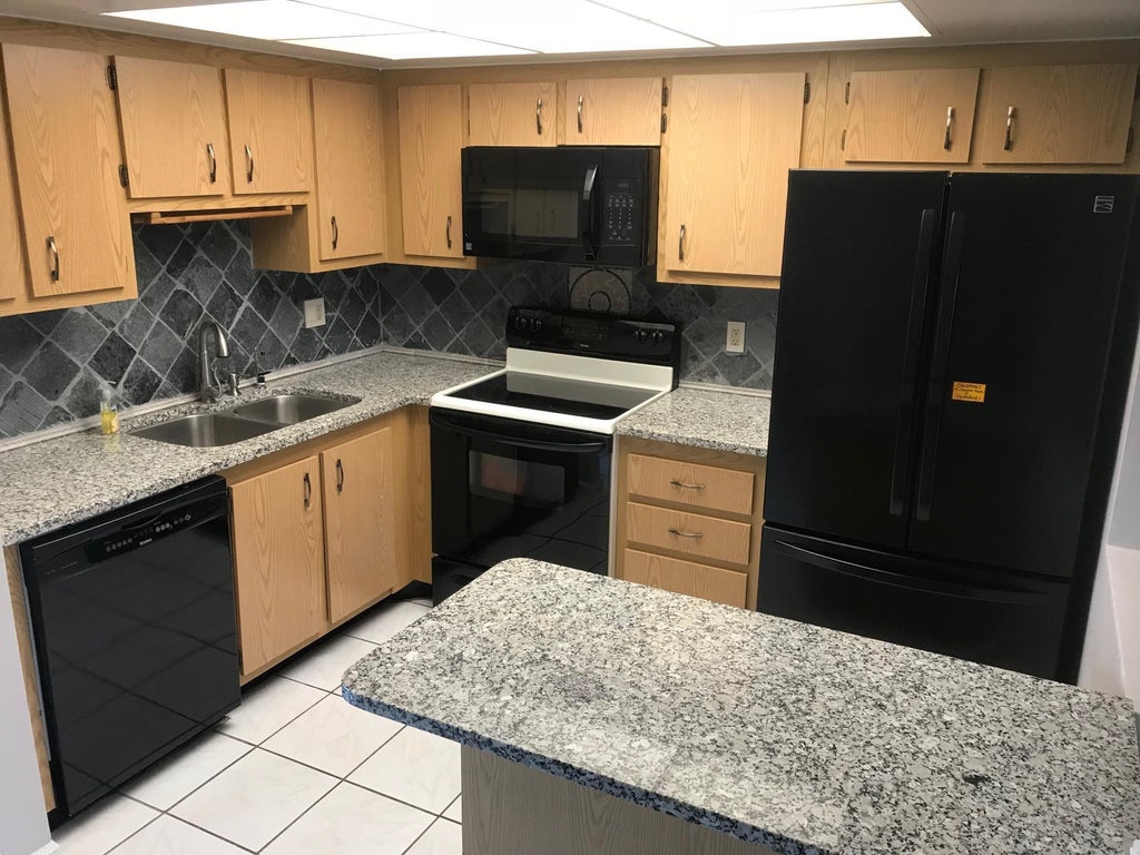 Photo of 4147 Oak Terrace Drive, Greenacres, FL 33463 (MLS # B26042921)