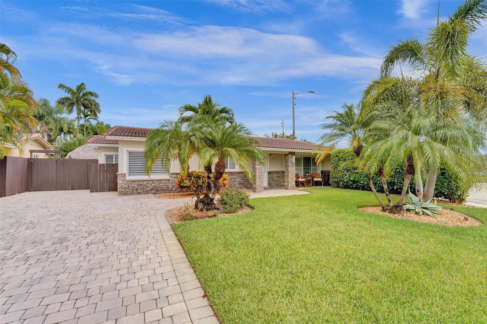 DON’T MISS THIS AMAZING OPPORTUNITY CENTRALLY LOCATED IN LAKERIDGE – MINUTES TO THE BEACH, RESTAURANTS, DOWNTOWN AND SHOPPING! THE MAIN HOME HAS 3 ENSUITE BEDROOMS PLUS A DEN AND AN ATTACHED PRIVATE IN-LAW SUITE WITH AN ADDITIONAL BEDROOM, LIVING ROOM, BATHROOM & KITCHENETTE! THIS HOME IS PRISTINE AND EXQUISITELY KEPT! LARGE OPEN FLOOR PLAN PERFECT FOR ENTERTAINING! PRIVATE OWNER’S SUITE WITH WALK IN CLOSET AND BATHROOM! RESORT-LIKE OVERSIZED FENCED IN YARD – TROPICALLY LANDSCAPED! TIKI-HUT WITH BUILT IN GRILL AND REFRIGERATOR! HEATED POOL WITH GREAT SPACE FOR LOUNGE SEATING AND FIRE PIT! ALL IMPACT WINDOWS AND DOORS - LARGE DRIVEWAY & ELECTRIC CHARGING STATION - WELL SPRINKLERS – AND MUCH MORE! CURRENTLY OPERATING AS A SUCCESSFUL VACATION RENTAL AND CAN BE SOLD AS SUCH.