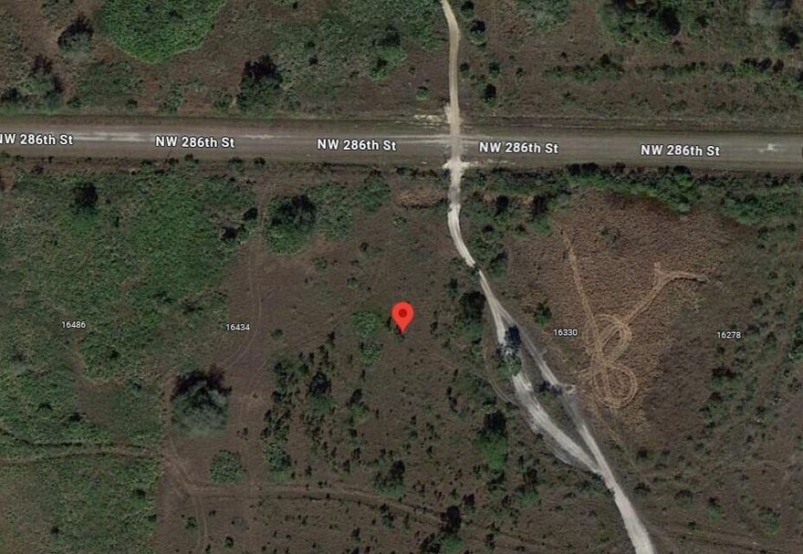 Welcome to this beautiful 1.25-acre parcel located in the desirable Viking/Prairie area of Okeechobee! This spacious vacant lot has already been cleared, giving you a head start on creating your ideal setup—whether you're planning a weekend retreat, agricultural use, or future homesite. The property is fenced on three sides, offering added privacy, definition, and security. Enjoy the freedom and wide-open space this growing area provides, with plenty of room for animals, toys, and outdoor living. No HOA and flexible zoning make this a perfect opportunity for those seeking land with potential. This parcel is currently fenced together with the neighboring lot, but the owners are selling only 1.25 acres. Access to the property is through the neighboring lot, and a gate/culvert will need to be installed on the sold portion for entry after purchase. A stake marks the division between the two lots in front of the fence. There's a two-car garage on the property that will be removed before closing.