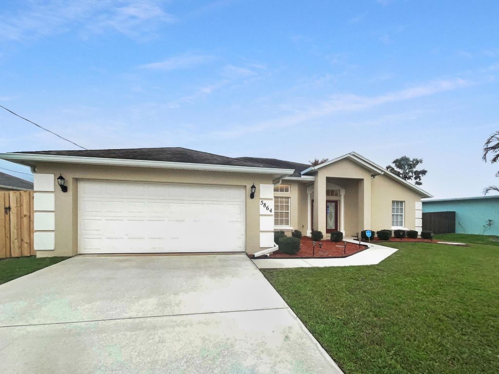 Photo of 5864 NW Hann Drive, Port Saint Lucie, FL 34986 (MLS # B26004860)