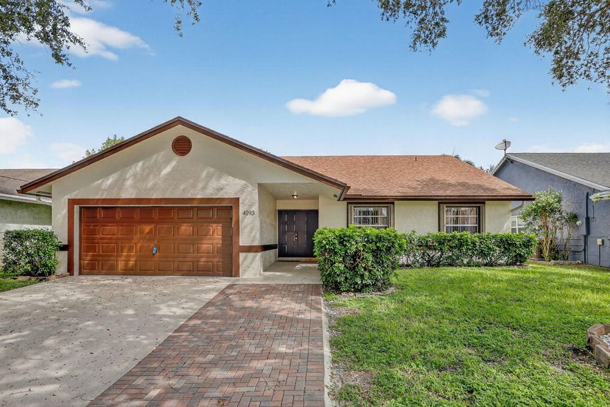 Discover this spacious 3-bedroom, 2-bath home offering a perfect blend of comfort and elegance. From the moment you enter, you'll be greeted by soaring ceilings, abundant natural light, and an open layout designed for both relaxation and entertaining. The gourmet kitchen features high-quality cabinetry, granite counters, and  SS appliances, opening to a family room. The remodeled primary suite is a true retreat with a spa-style bath and walk-in closets. Outdoors, enjoy a covered patio and private backyard ideal for gatherings. Roof 2022, Water heater 2022, new washer and dryer. Located in one of the most desirable private neighborhoods of Coconut Creek, Close to top-rated schools, shopping, dining, and major highways--walk to the Coconut Creek Rec Cent