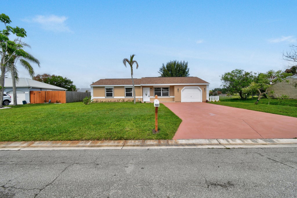 Photo of 1502 SE Belcrest Street, Port Saint Lucie, FL 34952 (MLS # B26032933)