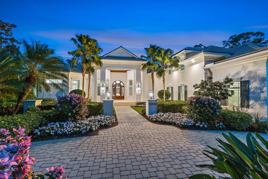 Fantastic opportunity to acquire this exceptional 3BR/5.1BA residence boasting a bonus room with full bath, elegant office/den, three-car garage and separate golf cart garage, all on a spacious 2/3-acre lot within the esteemed, gated club community of Old Marsh Golf Club. Crafted by renowned G.W. Purucker Homes, this custom-built estate showcases the finest finishes in a timeless, transitional design.  With over 4,500 sq ft of living space and an expanded outdoor living area, this home is ideal for entertaining!  Delight in the Chef's kitchen while engaging with guests in the spacious great room.  The distinctive open floor plan seamlessly connects to the outdoor living area through pocketing sliding glass doors, leading to the covered patio with motorized screens, summer kitchen and...