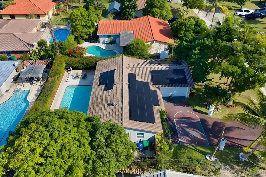 A Truly Unique and Special home that is hard to find.. Newer Roof, Large Pool. The X-Large In-Law Suite has Full Bath, Sitting area and even space for a Kitchenette..separate entrance adds lots of possibilities... This single family home is located on a quiet street with No HOA! Ample Parking for 5 Cars, Basketball Court in Driveway, 2 Car Garage, Very Clean and Nicely Renovated over the years, this comfortable 4 Bedroom / 4 Bathroom property is a Rare Find! Large Bedrooms with attached Baths, Galley style Kitchen has Wood Cabinets, Granite Countertops and Stainless Appliances...and the nice circular flow to this home provides everyone both plenty of privacy and spaces to be together. Large Private Fenced Pool for Entertaining or Relaxing. The Very Low Taxes for 2026 are a Huge Bonus too!